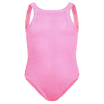 The Girls' Classic Swim One-Piece by Hunza G is a sleeveless pink swimsuit in Original Crinkle fabric, featuring a high neckline and moderate leg cut for stretchy comfort, shown on a white background.