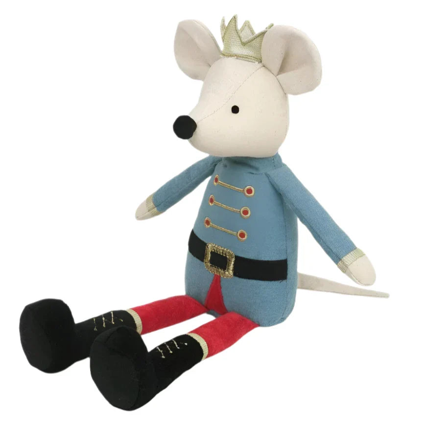 The MON AMI King Mouse from Mon Ami, a white plush toy dressed in a blue soldier uniform with gold accents, a black belt, red and black boots, and a gold crown, is seated upright.