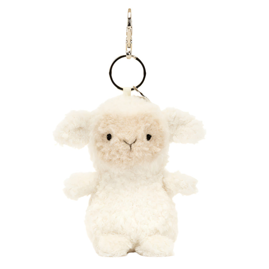 This charming Jellycat Little Lamb Bag Charm plush keychain has cream fur, a metal loop, and clasp for easy attachment, and resembles the beloved Jellycat disc accessory.