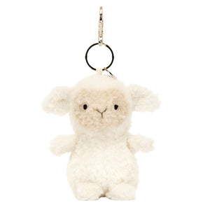 This charming Jellycat Little Lamb Bag Charm plush keychain has cream fur, a metal loop, and clasp for easy attachment, and resembles the beloved Jellycat disc accessory.