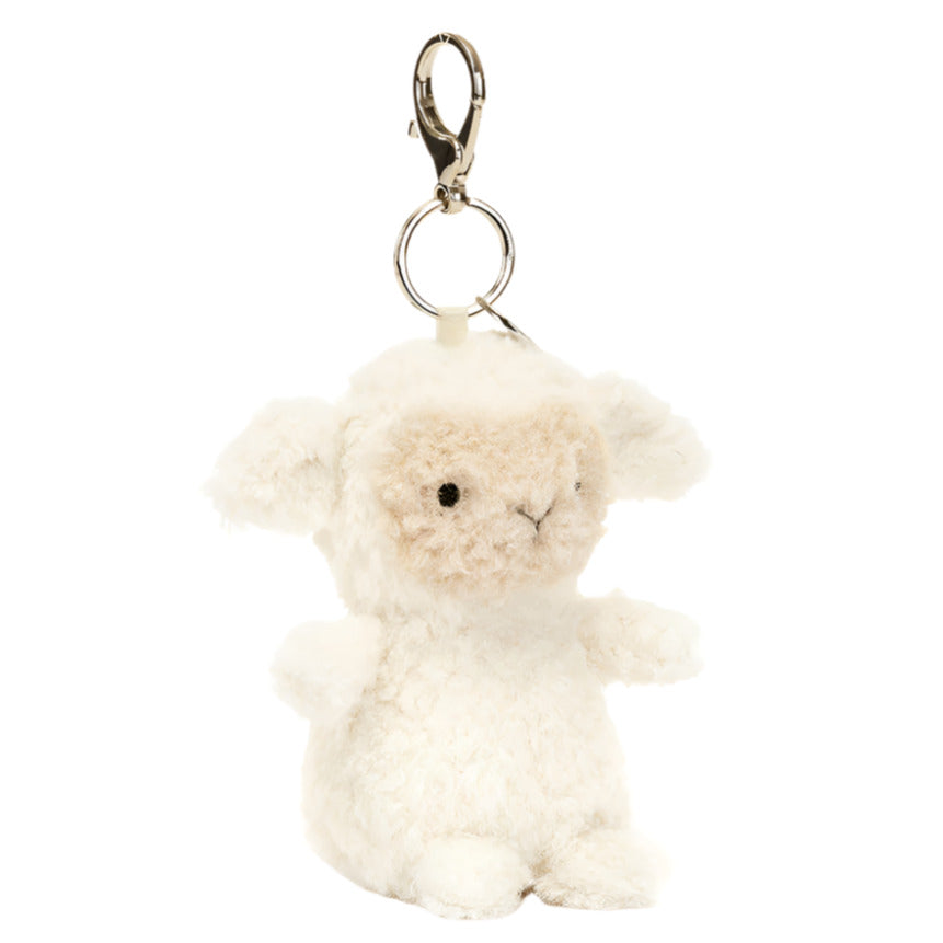 The Jellycat Little Lamb Bag Charm by Jellycat includes a plush sheep keychain with a metal clasp, featuring soft cream fur and small black eyes.