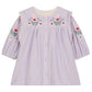 The Louise Misha Baby Girls’ and Girls’ Anette Dress is a light purple corduroy dress featuring long sleeves, front buttons, and multicolored floral embroidery on the yoke and sleeves.