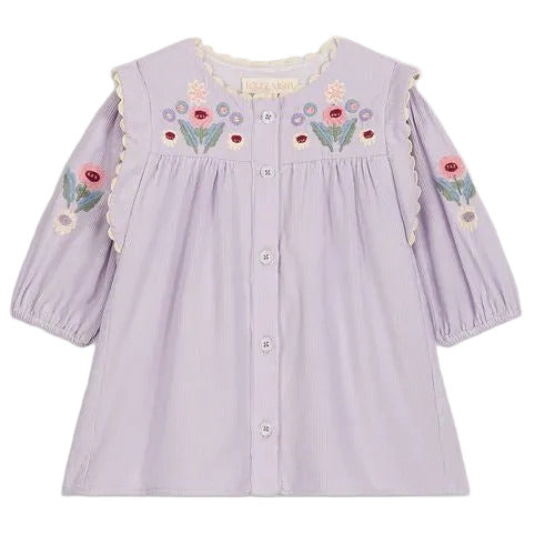 The Louise Misha Baby Girls’ and Girls’ Anette Dress is a light purple corduroy dress featuring long sleeves, front buttons, and multicolored floral embroidery on the yoke and sleeves.