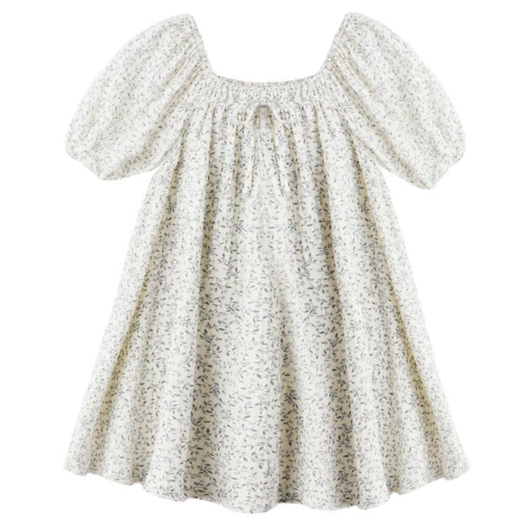 The Rylee & Cru Girls' Sabrina Mini Dress showcases a white floral print, short balloon sleeves, a smocked neckline with front tie, and a loose, flared silhouette for effortless charm.
