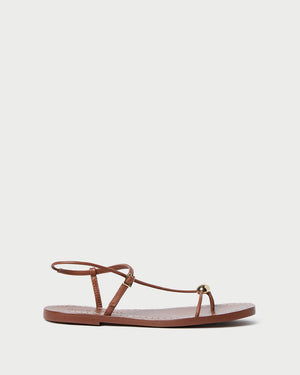 The Lara Sandal by Loeffler Randall features timber brown nappa leather, thin straps, a toe loop, and an ankle buckle, shown against a plain white background.