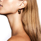 Profile view of a person with long, straight, blond hair wearing the Lie Studio LIÉ STUDIO Andrea Earrings, the perfect accessory to elevate any look.