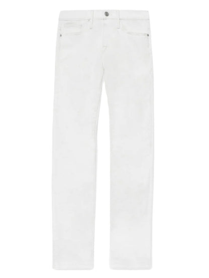 The Frame L'Homme Slim jeans feature a mid rise, straight leg, five-pocket design and button closure in white, shown against a white background.