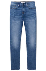 Introducing the Frame Men's L’Homme Slim Denim Capistrano, a pair of blue denim jeans featuring a slight fade on the thighs and knees, front pockets, and button closure. Crafted from comfort stretch denim, these jeans offer a mid-rise waist for added ease and a slim leg for a modern fit.