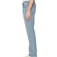 A person stands in side profile against a plain white background, wearing a white shirt, Frame L’Homme Slim Denim in light blue wash, and white shoes.