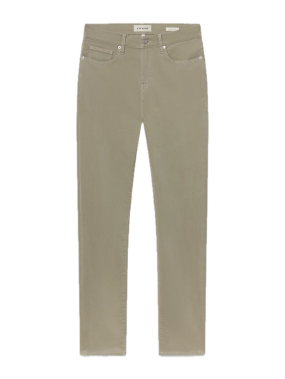 L’Homme Slim jeans by Frame in beige, tailored in a slim-fit silhouette from brushed twill, featuring five pockets, belt loops, and a button closure, displayed flat on a white background.