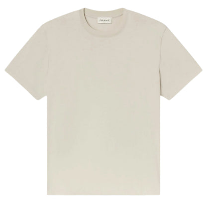 The Frame Logo Tee, a premium beige cotton crewneck with short sleeves, is displayed flat on a white background. A small neck label reads "FRAME.