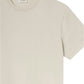 The Logo Tee by Frame is a beige, short-sleeve crewneck made from premium cotton with a round neckline and an inside collar label featuring the brand name.