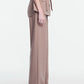 A person stands in side profile against a plain white background, wearing the Lela Rose Melange Crepe High Waisted Pant paired with a taupe belted blouse featuring pocket flaps and a tailored leg.