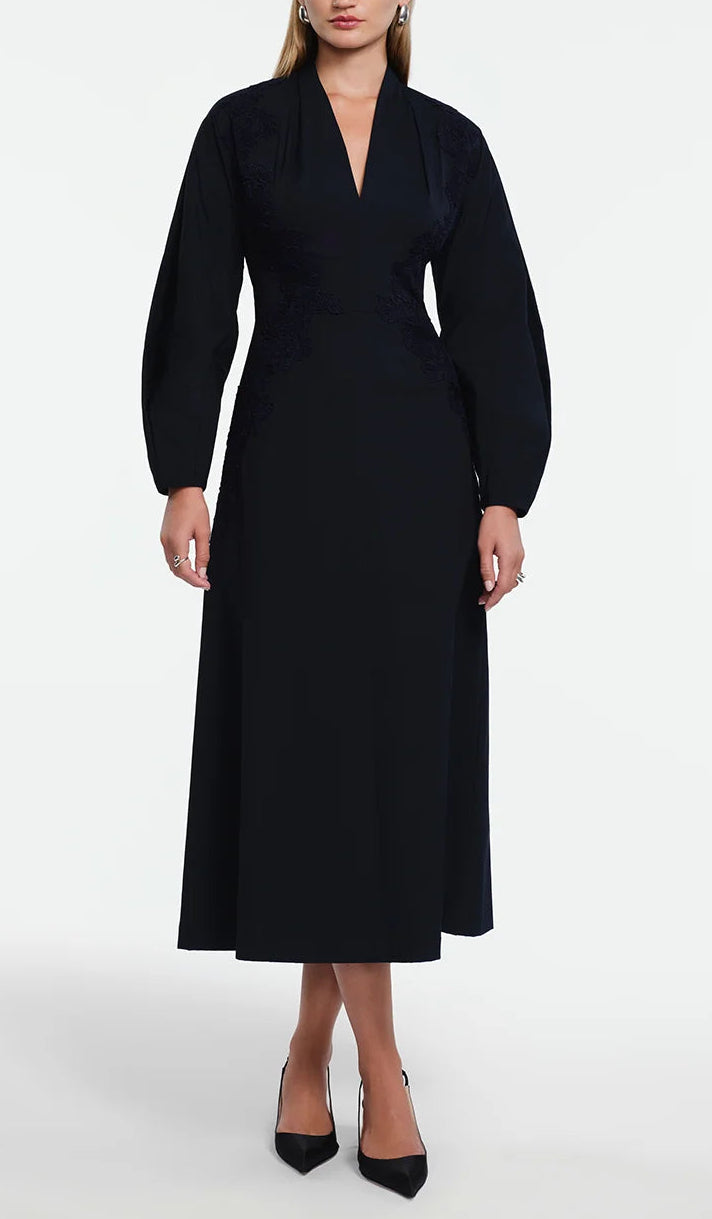 Lela Rose Macrame Lace Detail Dress: a black cotton poplin midi dress with long sleeves, a V-neck, and tonal lace appliqué at the waist in an A-line silhouette.