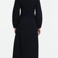 Back view of a black Lela Rose Macrame Lace Detail Dress in cotton poplin, featuring a high neckline, macrame lace waist detailing, and an A-line midi silhouette.