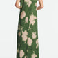 A person wears the Lela Rose Abstract Floral Crepe Draped Gown, featuring a straight-fit silhouette and short sleeves, shown from the back against a plain background.