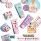 Flat lay of the Super Smalls Create Your Own Body Lotion kit, featuring kid-safe lotion tubes, sparkling nail gems, and a child modeling the products. The vibrant packaging highlights cruelty-free, non-toxic, and allergen-free qualities—making this Super Smalls kit perfect for safe and creative self-care fun.