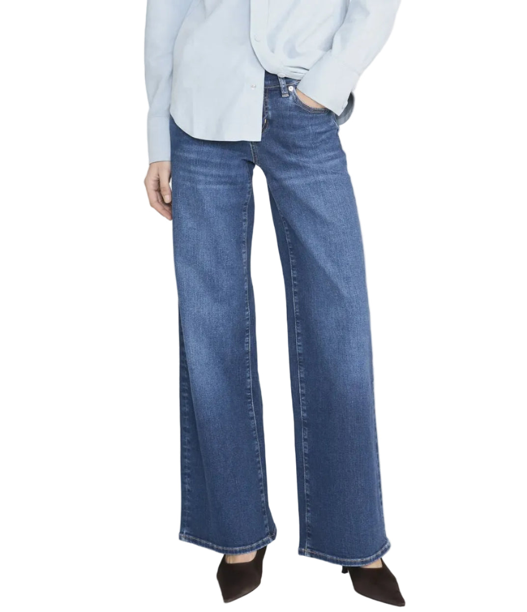 Person wearing a light blue button-up shirt, FRAME Low Rise Le Slim Palazzo women's jeans, and dark pointed-toe shoes, standing against a white background.