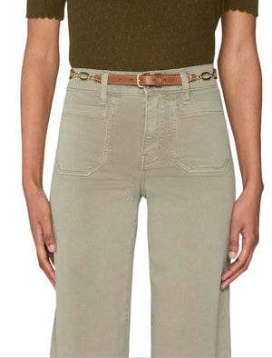 A person wears Frame’s Le Slim Palazzo Modernist Pocket light khaki high-rise pants with front pockets, paired with a brown belt and a dark green short-sleeve top.