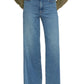 A person wears the Frame Le Slim Palazzo high-rise, wide-leg flare blue jeans, a khaki jacket, and taupe heeled shoes. The upper body and face are not shown.