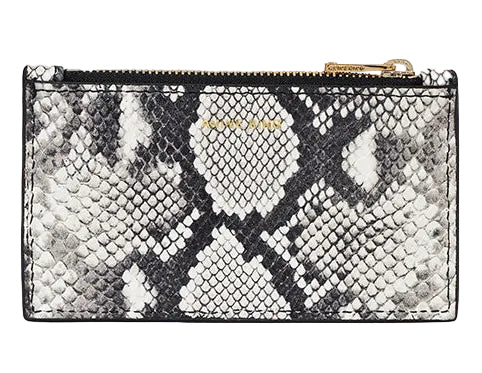 The Anine Bing Lucy Card Holder features a rectangular zippered design with a black and white python print, gold-tone zipper, and compact size; the brand name appears subtly near the top.