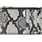 The Anine Bing Lucy Card Holder is a rectangular zippered wallet featuring a black and white python print, displayed against a white background.