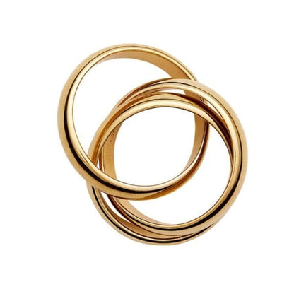 The Sofie Ring by Lie Studio features two interlocking gold rings on a white background, showcasing a chunky statement design.