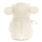 The Jellycat Bashful Lamb Soother, made by Jellycat, showcases its cream-colored fur, round ears, and small tail from a back view. Crafted with recycled fibers, it's the perfect adorable gift for a newborn.