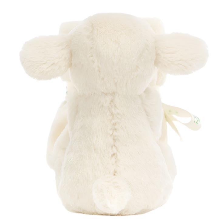 The Jellycat Bashful Lamb Soother, made by Jellycat, showcases its cream-colored fur, round ears, and small tail from a back view. Crafted with recycled fibers, it's the perfect adorable gift for a newborn.