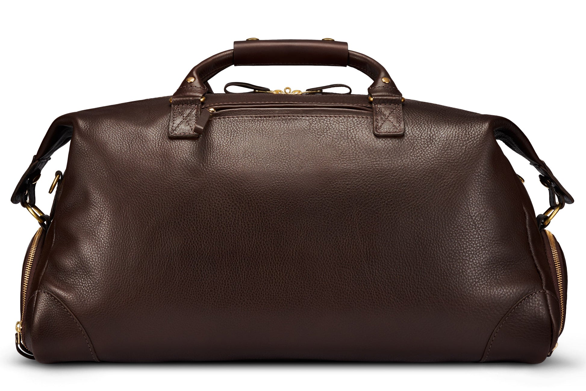 The Bennett Winch Leather Weekender, a luxury travel bag made from full-grain leather in a dark brown hue, boasts sturdy handles and side zippers, displayed elegantly against a plain white background.