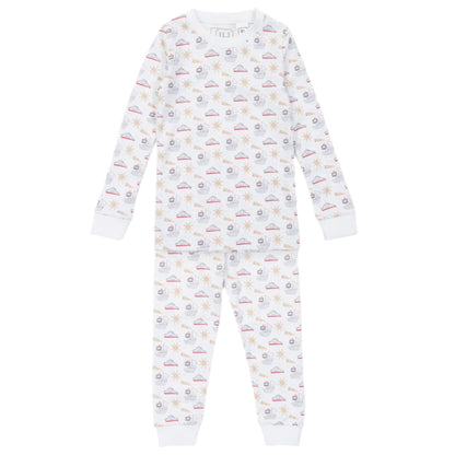 The Lila & Hayes Baby Boys' and Boys' Grayson Pajama Set features long sleeves and pants in soft Peruvian Cotton, with an elastic waistband and a white background adorned with colorful boats and stars.
