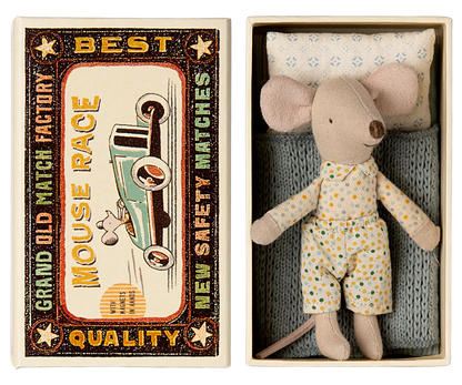 A small Maileg Little Brother mouse wearing pajamas rests in a matchbox bed adorned with a vintage racecar design and text that reads: "Grand Old Match Factory, Best Quality, Mouse Race, New Safety Matches.