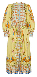 The Hunter Bell NYC Lillian Dress is a long, floral-patterned piece featuring puffed sleeves, a cinched waist, and charming button-front styling with orange and blue designs on a graceful white background.