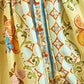 Check out the Hunter Bell NYC Lillian Dress, a lively piece with an orange floral skirt, a button-front design, and a decorative blue stripe.