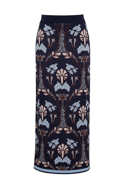 The Cara Cara Lillian Skirt from Cara Cara features a jacquard knit in navy blue, beige, and light blue floral patterns within vertical symmetrical ovals, offering the elegance of a pencil shape.