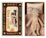 A Maileg Little Sister mouse, dressed in a charming polka-dot outfit, rests comfortably in a matchbox bed crafted from soft fabrics, nestled inside a cardboard box. The box is labeled "Maileg Little Sister, Mouse in Matchbox" and features delightful vintage matchbox-style graphics on the lid.