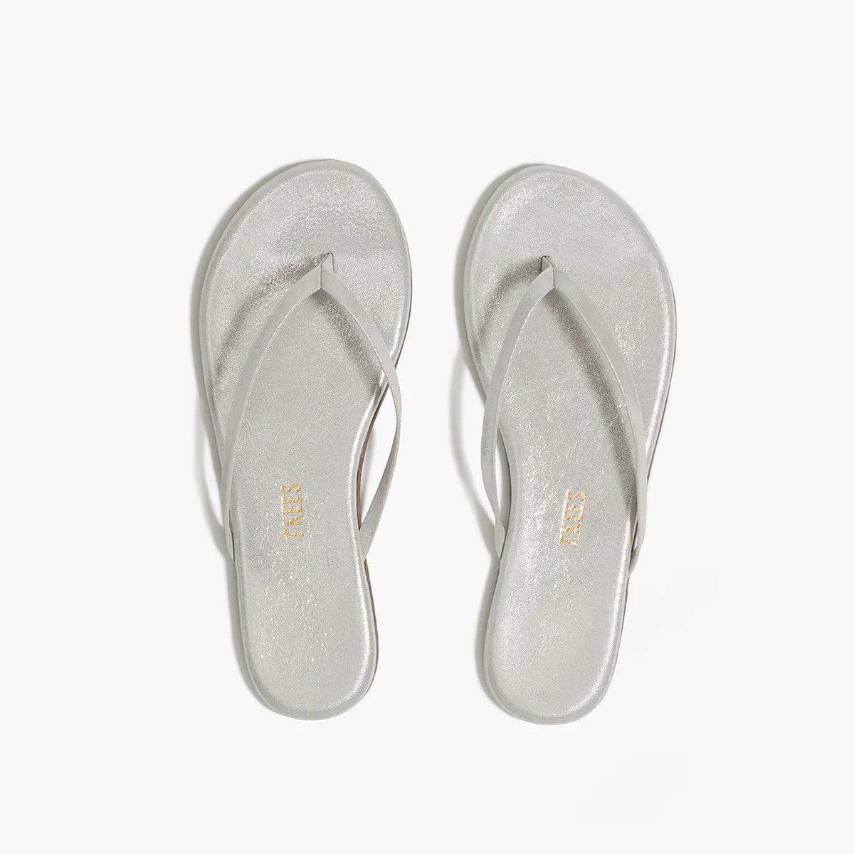 Tkees Lily Glitters Sandals feature thin straps and a cushioned insole, displayed from above on a white background.