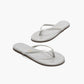 The Tkees Lily Glitters Sandals feature silver glittery thin straps, flat soles, and a cushioned insole for extra comfort, showcased on a white background.