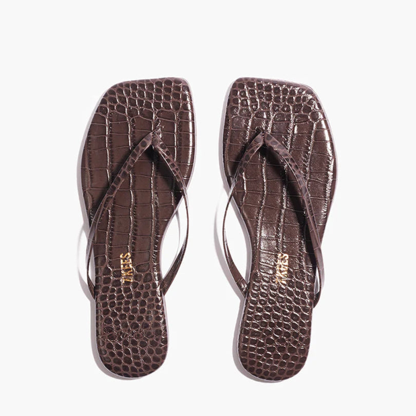 The Tkees Lily Square Toe Croc Sandals, featuring brown crocodile-embossed leather, square toes, and thin straps, are displayed side by side on a white background.