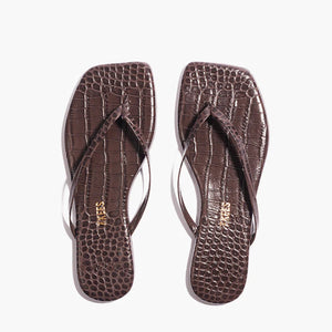 The Tkees Lily Square Toe Croc Sandals, featuring brown crocodile-embossed leather, square toes, and thin straps, are displayed side by side on a white background.
