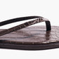 Close-up of the Tkees Lily Square Toe Croc Sandal, featuring dark brown crocodile-embossed leather, a square toe, and simple thong straps.