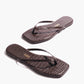 The Lily Square Toe Croc Sandal by Tkees is an elegant pair of brown crocodile-embossed flip-flop sandals with a stylish square toe, shown on a white background.
