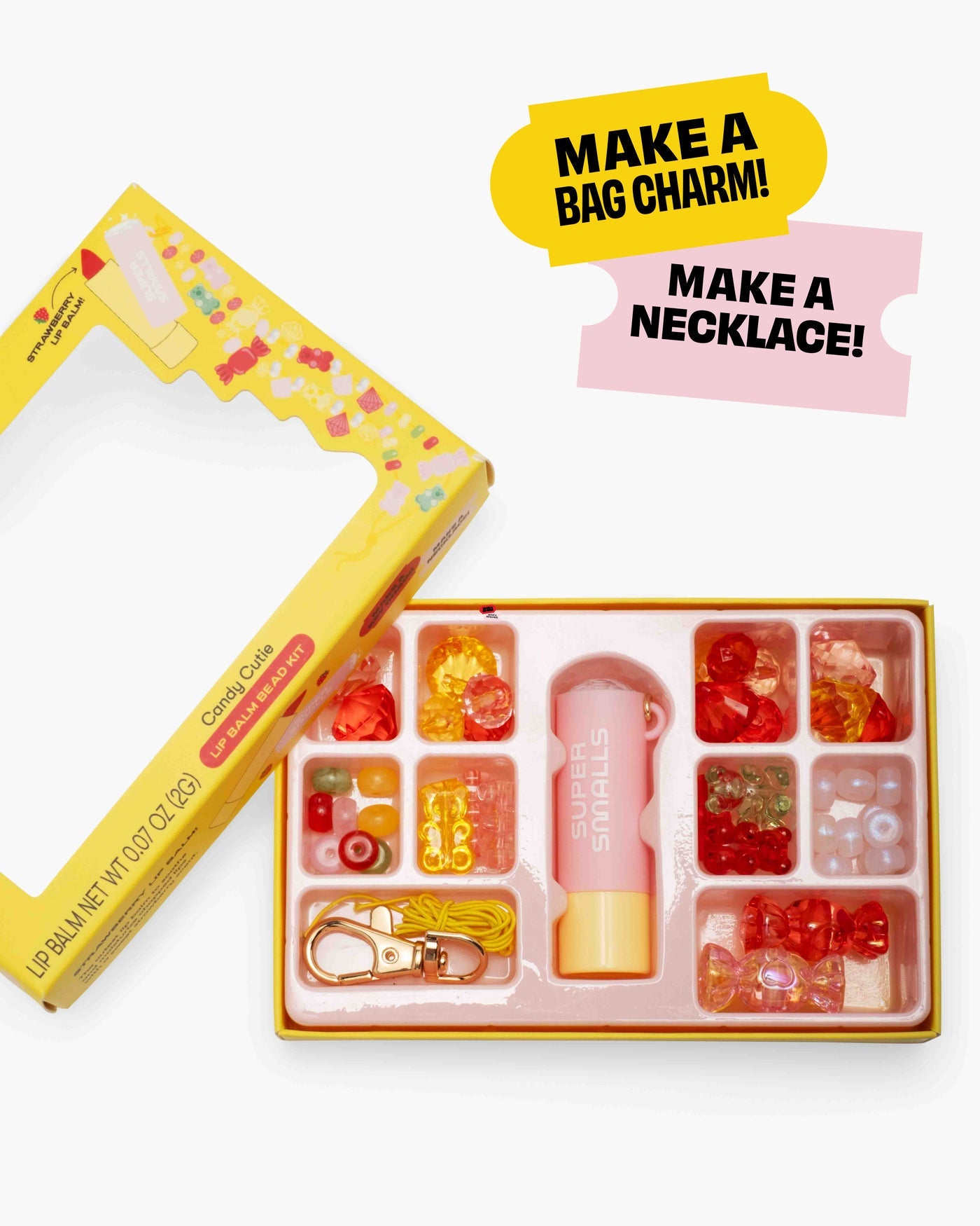 The Super Smalls Cutie Candy Lip Balm Bead Kit includes colorful beads, charms, a keychain clip, and strawberry-scented lip balm—everything kids need to make a fun DIY bag charm or necklace.