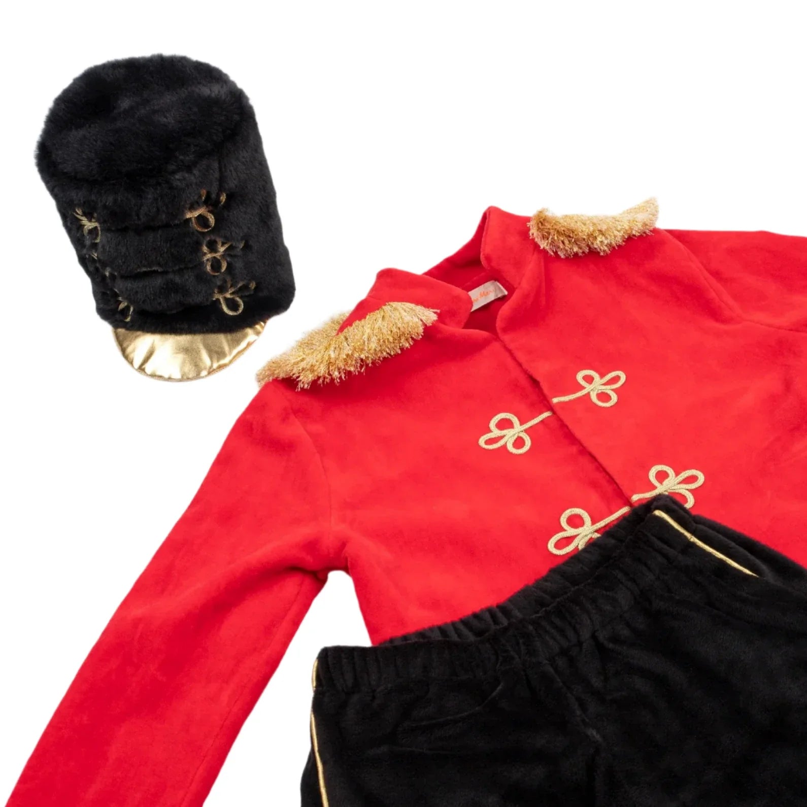 The Meri Meri Little Drummer Costume by Meri Meri is a luxurious ensemble for the festive season, featuring a red marching band jacket with gold trim, paired with black pants and a plush black fur hat adorned with shimmering gold accents. Perfect for imaginative play during Christmas.