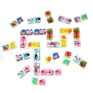 Eeboo's Little Farm Head to Toe Dominoes showcase colorful tiles featuring animals, trees, and flowers arranged in a winding path with extra pieces scattered on a white background, creating a delightful barnyard puzzle that's perfect as a kids’ travel toy.