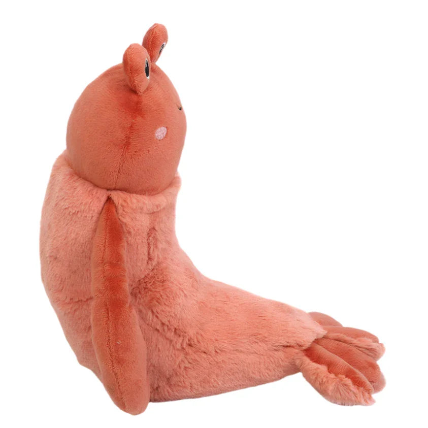A super-soft stuffed animal called Da Pinchi Lobster by Mon Ami, featuring flipper-like limbs and round eyes, is displayed from the side on a plain background.