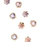 Nine gold earrings with flower and heart designs, accented by pink, purple gemstones and clear rhinestones, sit on a white background—perfect to pair with your favorite Super Smalls Love in Bloom Hair Clips.