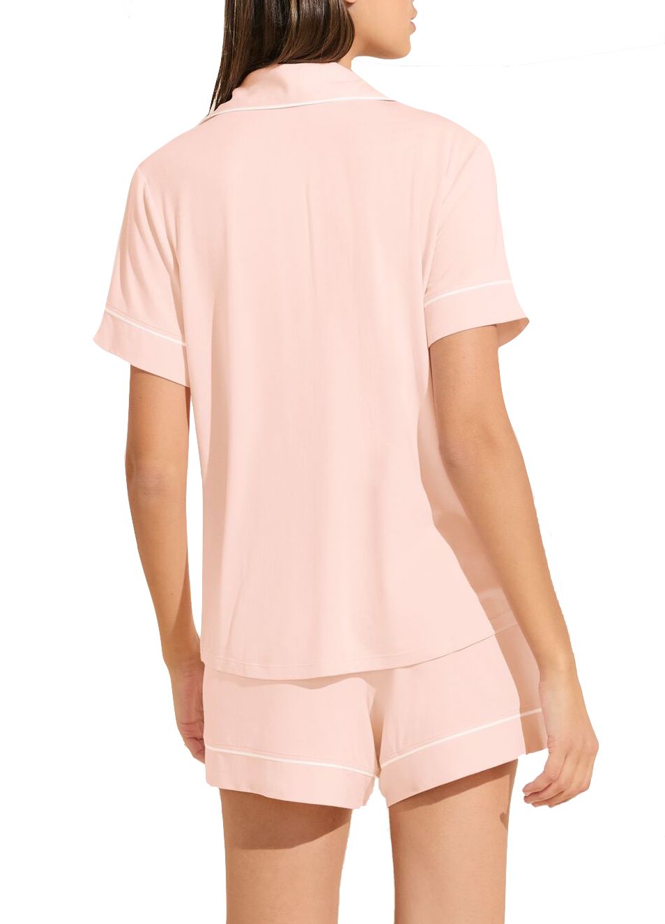 Woman wearing pale pink short-sleeved Eberjey Gisele Relaxed Short PJ Set pajamas, viewed from the back.