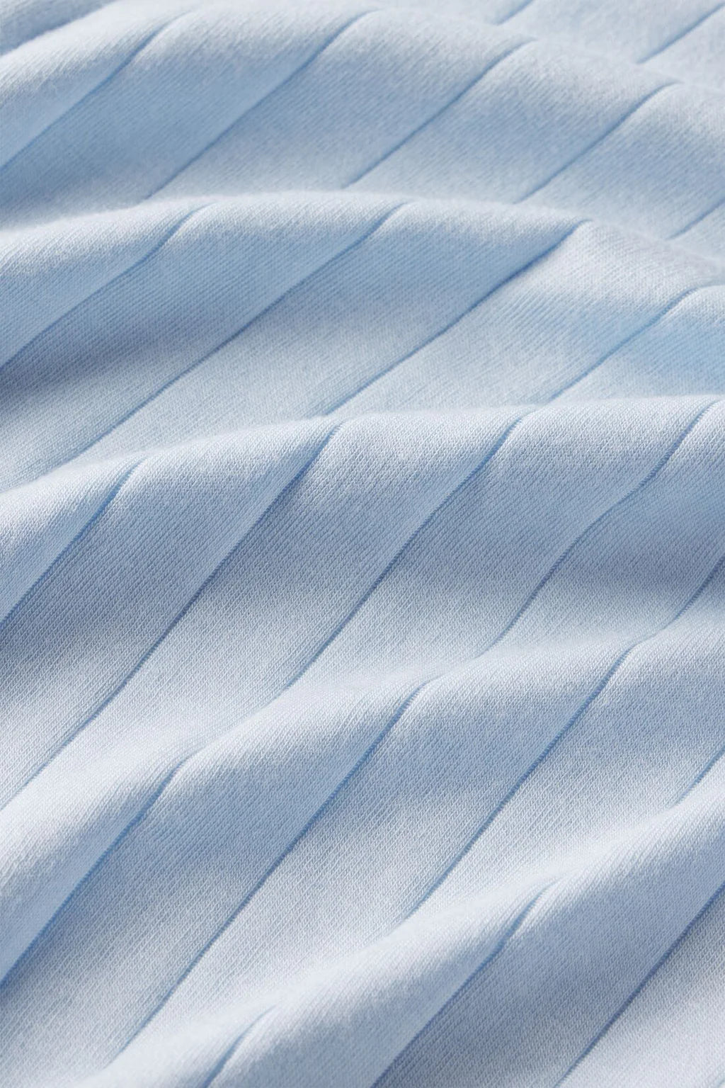 The Eberjey Gisele Rib Relaxed Short PJ Set features light blue ribbed fabric with diagonal ridges, a relaxed boyfriend fit, and an elastic waistband for effortless comfort.