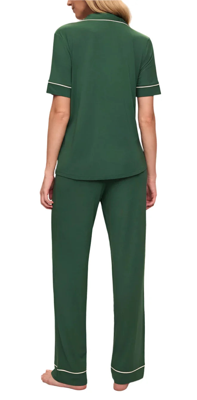 A person wearing the Eberjey Gisele Short Sleeve Long Pant PJ Set in dark green, crafted from sustainable TENCEL™ Modal, seen from the back.